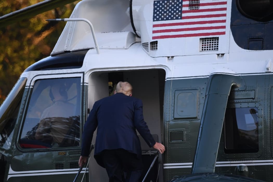 US President Donald Trump boards Marine One prior to departure from the South Lawn of the White House in Washington, DC, October 2, 2020, as he heads to Walter Reed Military Medical Center, after testing positive for Covid-19.