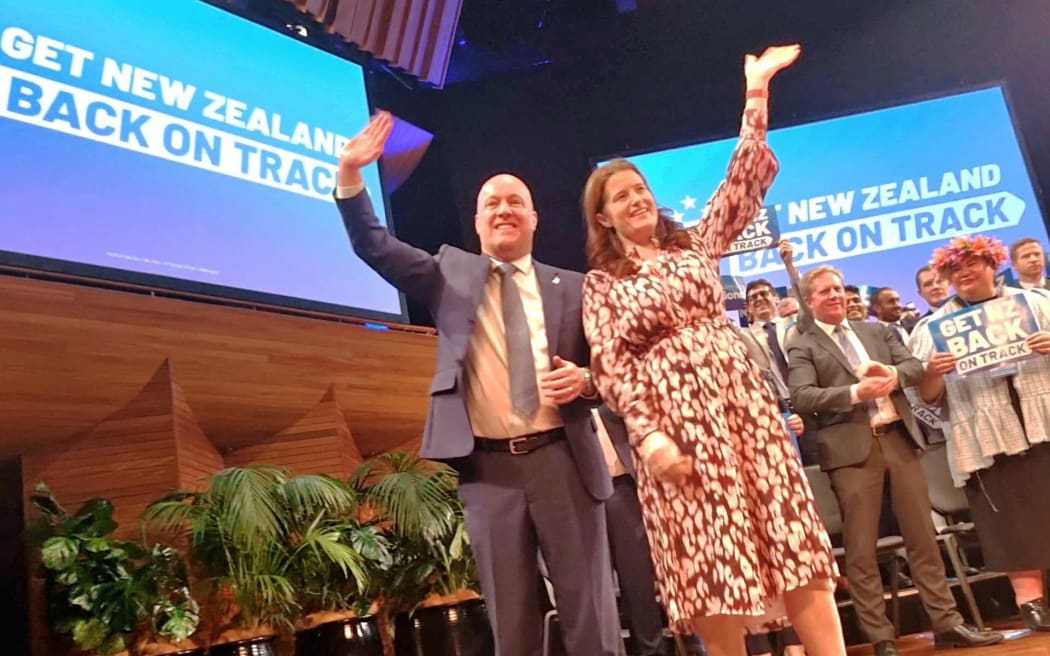 The National Party leaders wave to the faithful at the party's annual conference.