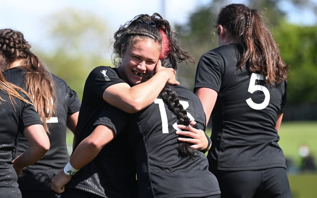 Ruby Tui hugs try scorer Sylvia Brunt of the Black Ferns in their match against Wales in the 2022 Rugby World Cup.