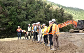Turning the soil on Waimea Dam.