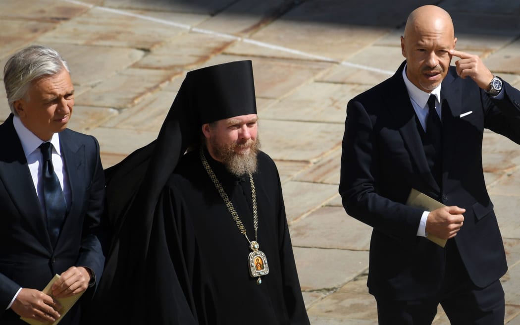 Gazprom Neft board director general Alexander Dyukov, left, Vicar of Patriarch Kirill of Moscow and All-Russia, Bishop of Yegorievsk Tikhon, Georgy Shevkunov, and film director Fyodor Bondarchuk.