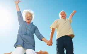 Senior couple jumping