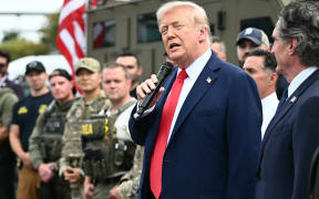 US President Donald Trump speaks while visiting federal troops at the US Park Police Anacostia operations facility in Washington, DC, on 21 August, 2025. Trump said he plans to patrol Washington's streets on Thursday with troops he deployed to the US capital in a show of force against what he claims is a "crime emergency." Trump ordered hundreds of National Guard to deploy in Washington last week vowing to "take our capital back," despite protests by some residents and statistics showing violent offenses falling.