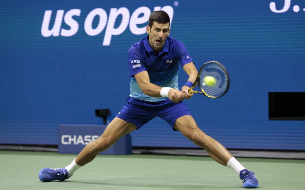 Serbia's Novak Djokovic hits a return to Germany's Alexander Zverev during their 2021 US Open Tennis tournament men's semifinal match at the USTA Billie Jean King National Tennis Center in New York, on September 10, 2021.