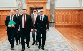 Finance Minister Grant Robertson (centre) and other MPs have been discussing the economic relief package.