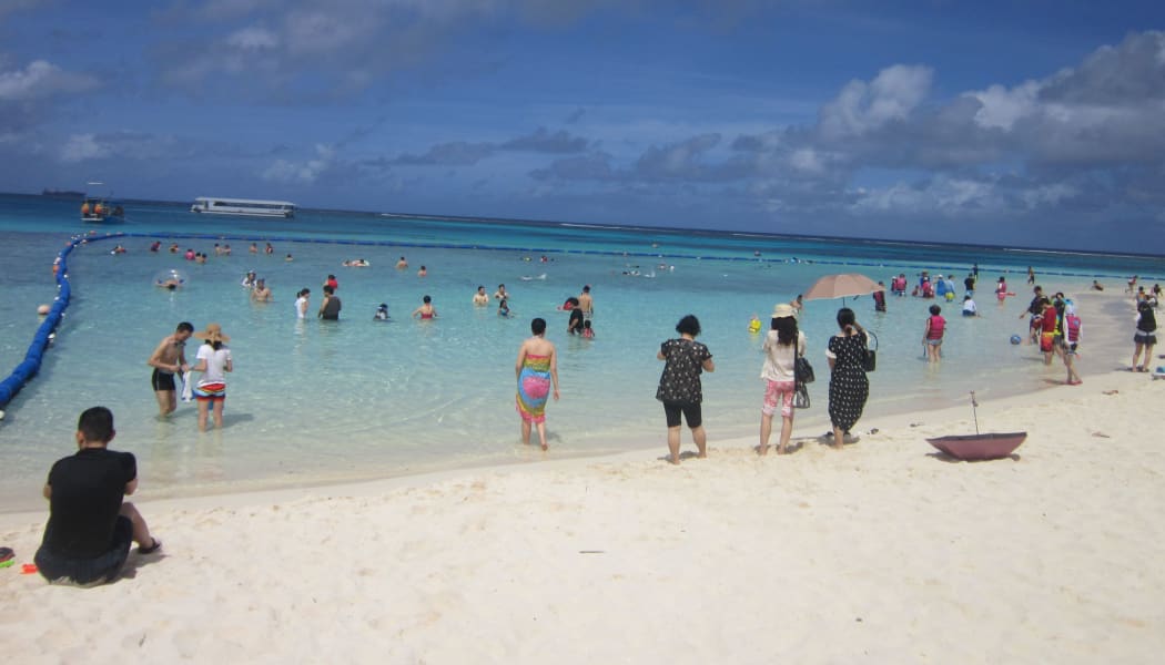 Asian tourists on a CNMI beach