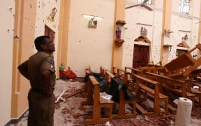 Officials inspect the damaged St. Sebastian's Church after multiple explosions targeting churches and hotels across Sri Lanka on Easter Sunday, April 21, 2019 in Negombo, north of Colombo, Sri Lanka.