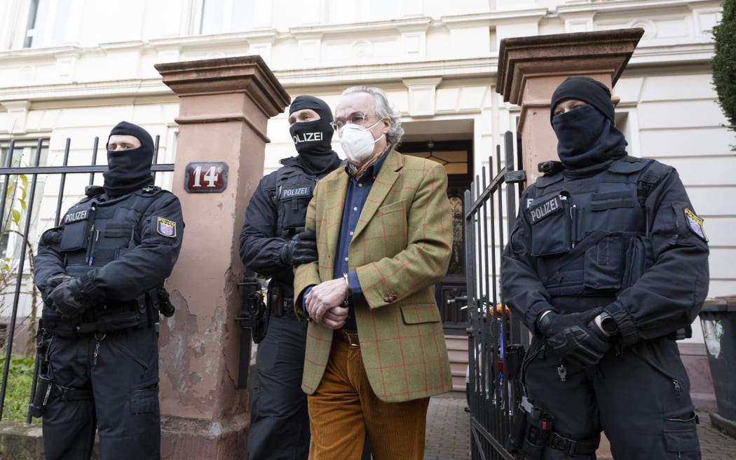 German special police forces detain Heinrich XIII Prinz Reuss after searching a house in Frankfurt / Main, western Germany, on 7 December, 2022.
