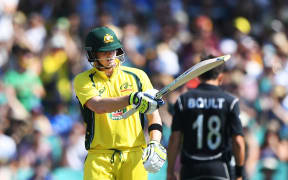 Australian captain Steve Smith celebrates his 50 in the first ODI in Sydney on 4 December 2016.