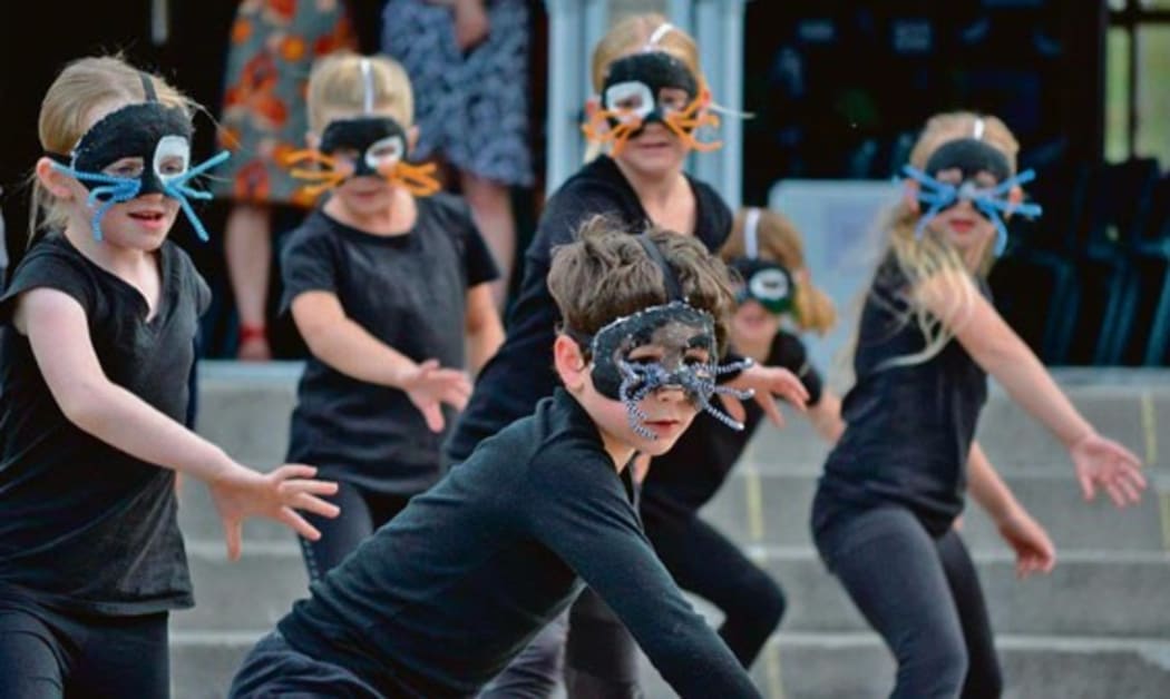 Children from Ohope Beach School performing the Evil Weasel Gang dance