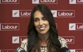 Jacinda Ardern listens to Andrew Little as they speak with media about Little nominating Ardern as Deputy Leader of the Labour Party. Wednesday 01 March 2017