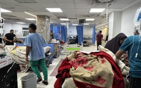 Patients and medics are pictured at Al-Shifa hospital in Gaza City on November 10, 2023, amid ongoing battles between Israel and the Palestinian Hamas movement. Heavy fighting was raging near Al-Shifa hospital, with Israel saying it had killed dozens of militants and destroyed tunnels that are key to Hamas's capacity to fight. Israel launched an offensive in Gaza after Hamas fighters poured across the heavily militarised border on October 7, killing 1,400 people, mostly civilians, and taking around 240 hostages. - NB Reuters report death toll 1200