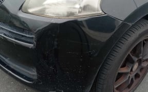 The damage to Austin Liu's car.