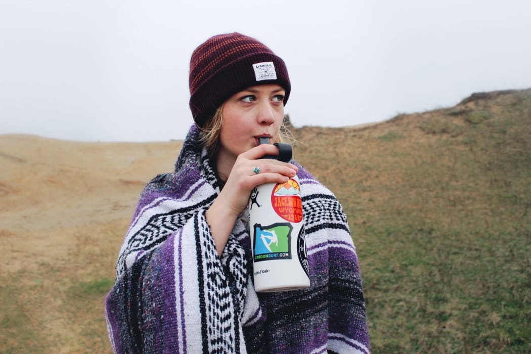 girl drinking from water bottle