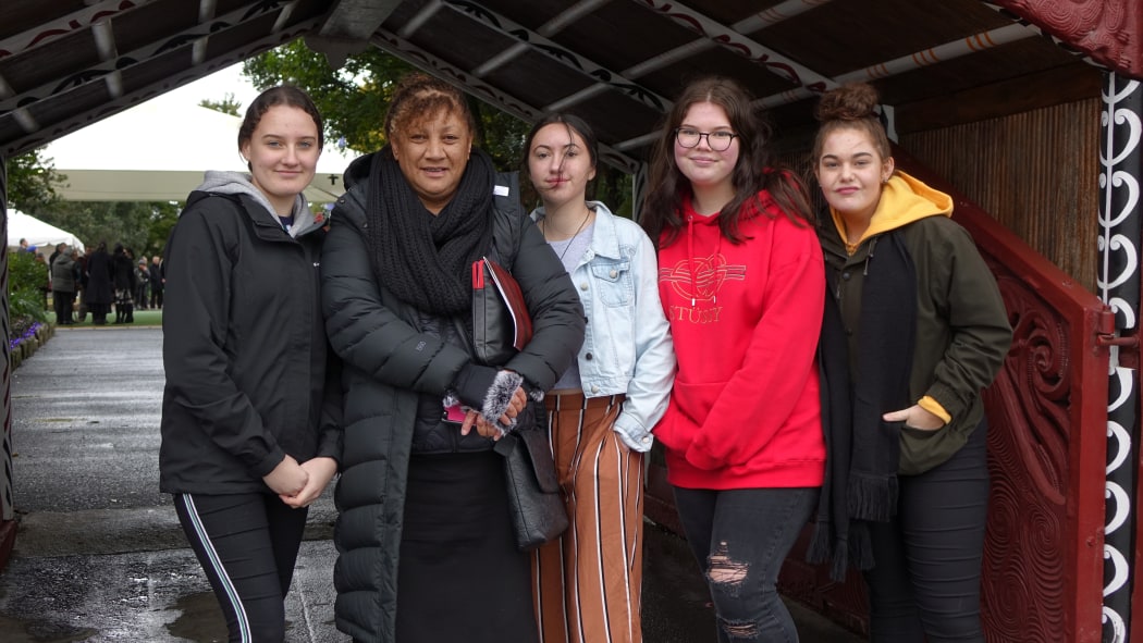 Phillipa Hakopa and rangitahi outside Tūrangawaewae Marae for the Koroneihana.