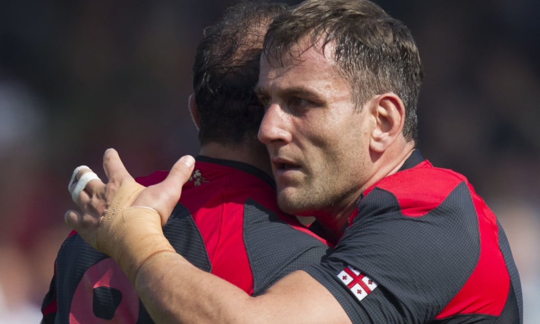 Mamuka Gorgodze of Georgia is congratulated after scoring a try against Tonga.