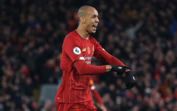 Fabinho of Liverpool celebrates scoring the opening goaL.