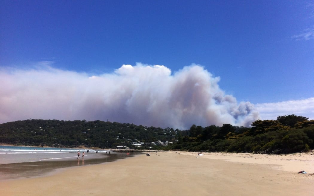 Smoke rises from a fast-moving bushfire near the Great Ocean Road in Victoria.