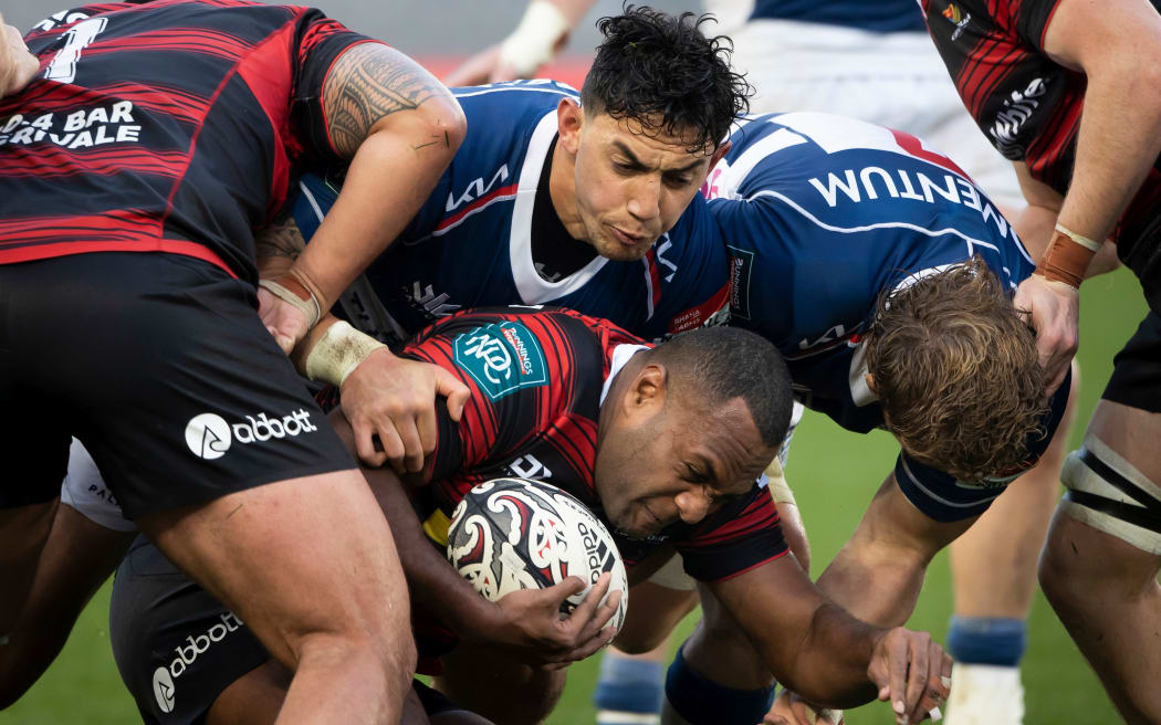Canterbury winger Manasa Mataele is wrapped up by Auckland players Bryce Heem and Blake Gibson  - NPC - National Provincial Cup rugby - Auckland  v Canterbury held at Eden Park - Auckland - New Zealand  08  August  2021.