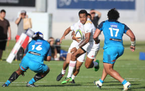 Chiefs player Latu Vaeno tries to slip between Blues players Hame Faiva, left, and Alex Hodgman during the Blues vs Chiefs pre season Super Rugby match played at Alexandra Park in Auckland on the 17th February 2017.