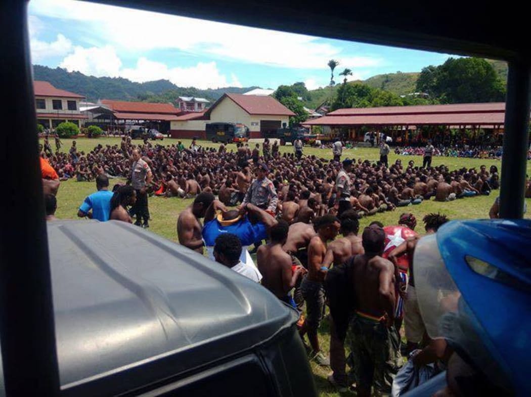 Indonesian security forces hold demonstrators
