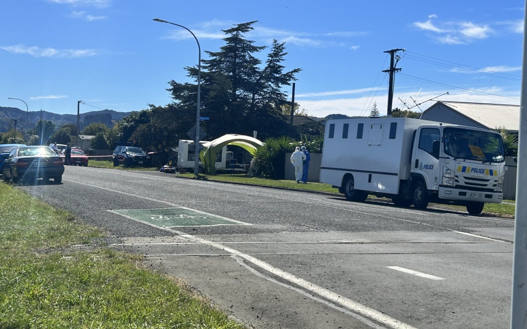Police at the scene of a mass brawl in Gisborne in which two people died.
