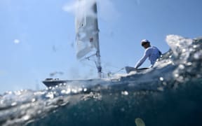 New Zealand's Thomas Saunders competes in race 1 of the men’s ILCA 7 single-handed dinghy event during the Paris 2024 Olympic Games sailing competition at the Roucas-Blanc Marina in Marseille on August 1, 2024. (Photo by Christophe SIMON / AFP)