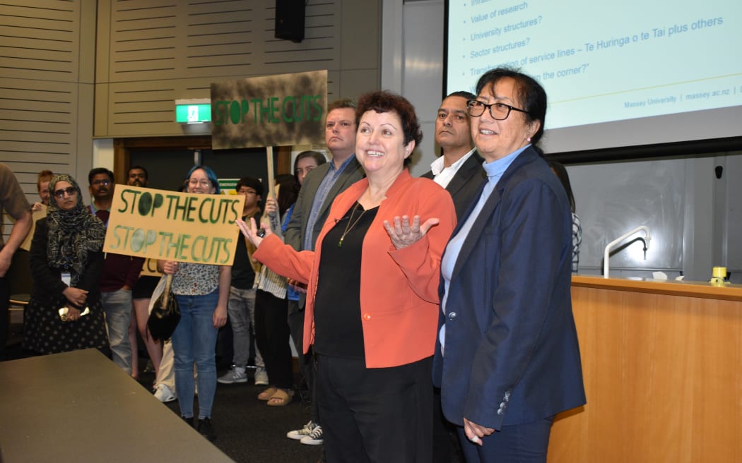 Staff and student protesters entered a meeting at Massey University's campus to demonstrate against proposed cuts, and call for the resignation of Vice Chancellor Jan Thomas.