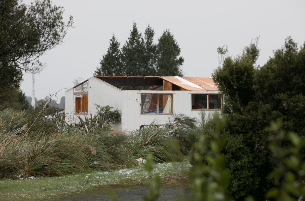 A house inside the cordon in National Park village has lost its roof.