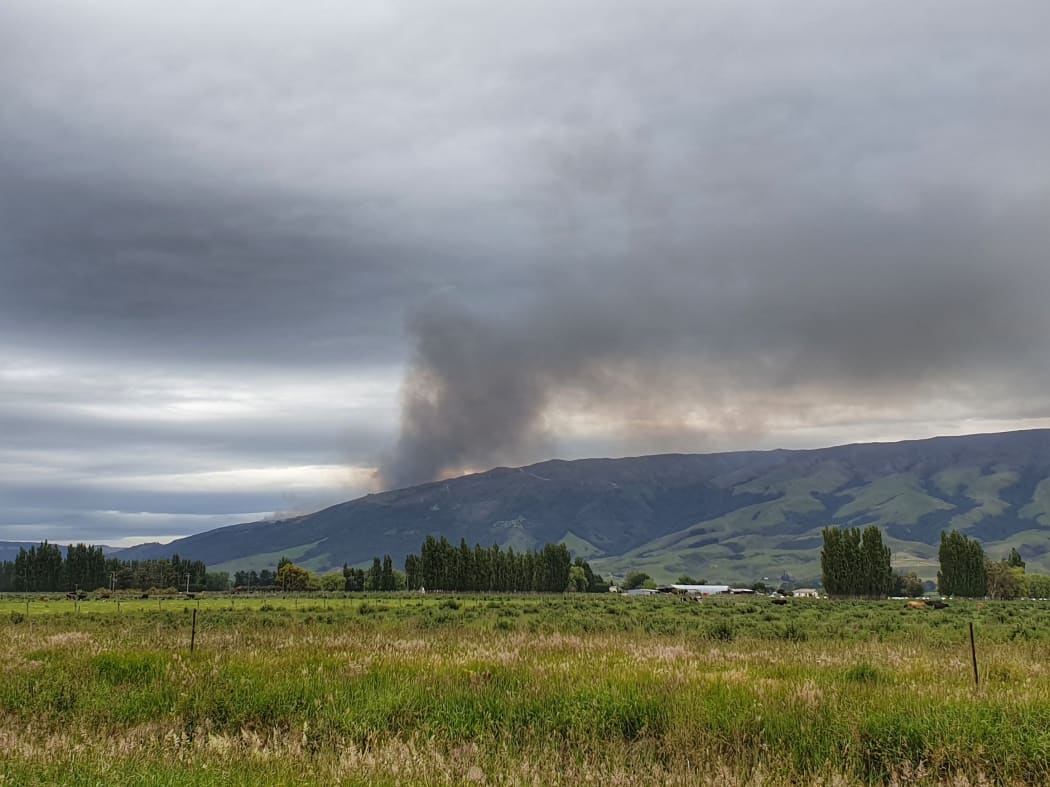 Fire crews are putting out a blaze near the Waipori River south of Dunedin.