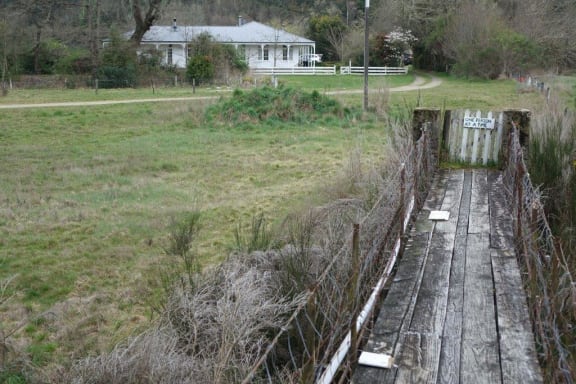 Home is across a swing bridge over the Dove River