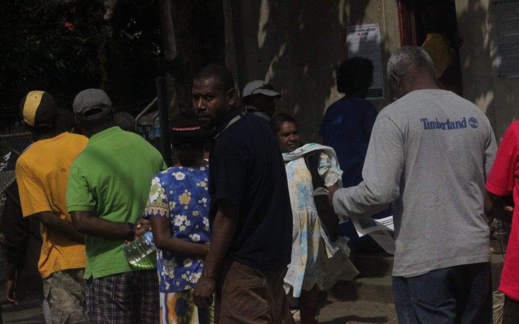 Voters at Dumbea Hall polling station
