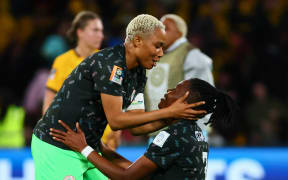 Nigeria defenders Onome Ebi and Osinachi Ohale celebrate their team's victory over Australia at the Women's World Cup in Brisbane.