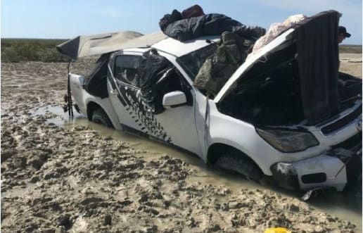 The two men slept on the roof of their car after they spotted a crocodile.
