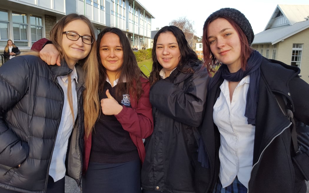 Year 12 student Willow Kingi-Laurence, second left, and her mates are okay with pants, but she'll be sticking with a skirt.