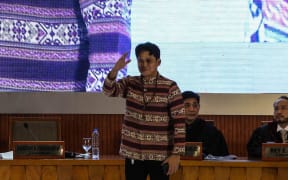 Actor Robin padilla, the senate front runner, waves as the Comission on Elections proclaims the twelve elected senators at the Philippine International Convention Center in Pasay, Metro Manila on May 18, 2022. (Photo by JAM STA ROSA / AFP)