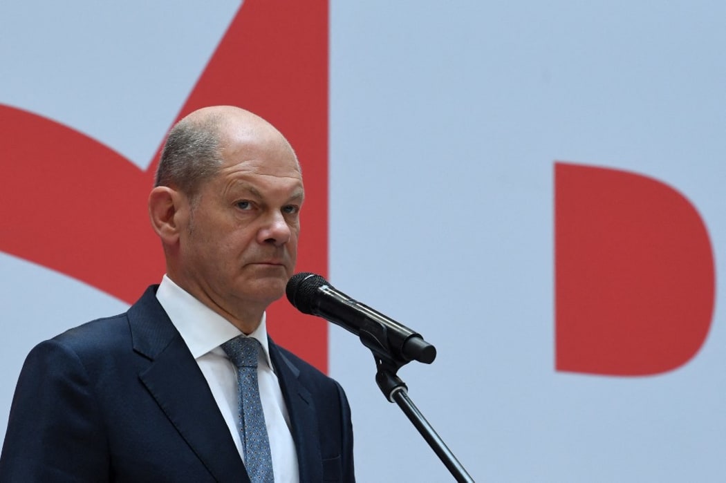German Finance Minister, Vice-Chancellor and the Social Democrats (SPD) candidate for Chancellor Olaf Scholz delivers a press statement at the party's headquarters in Berlin on September 27, 2021,
