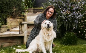 15082024 News Photo VANESSA LAURIE/STUFF

Lydia Frere was stuck in the Timaru Stream on Saturday August 4 at Weld Rd, near Oakura. She was rescued by police after her Golden retriever Archie fetched her coat, which had her phone in it. Pictured is Lydia and Archie