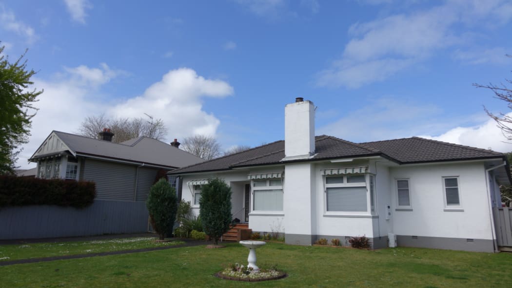 A house with a water fountain on Epsom's The Drive.