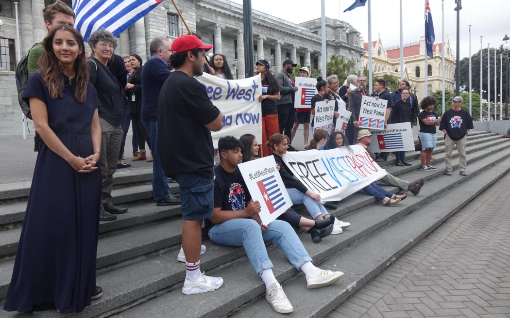 Golriz Ghahraman stands with the demonstrators.