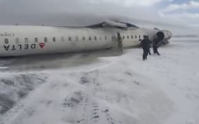 A plane crashed at Toronto Pearson International Airport and flipped on landing, injuring 8 people.