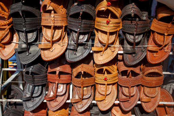 Shops selling traditional Indian footwear.