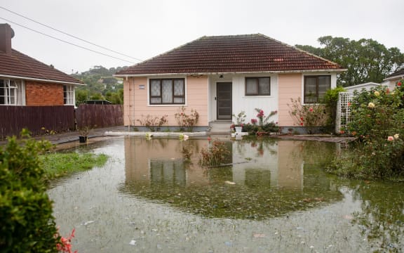 The home of Kannan Thiru was surrounded by a large pool of water still on Wednesday afternoon.