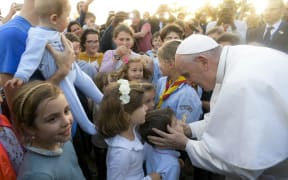 Pupils from the Catholic schools of Rabat greeting Pope Francis upon his arrival at the Apostolic Nunciature of the Holy See in Rabat