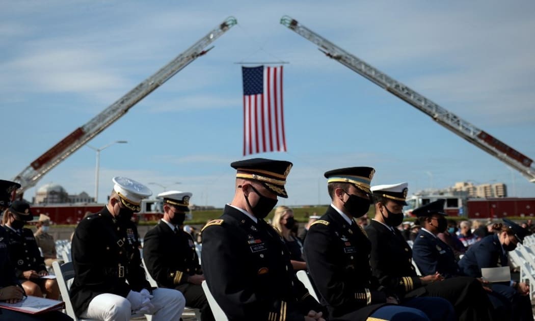 ARLINGTON, VIRGINIA - SEPTEMBER 11: U.S. service members attend the Pentagon 9/11 observance ceremony at the National 9/11 Pentagon Memorial on September 11, 2021 in Arlington, Virginia.