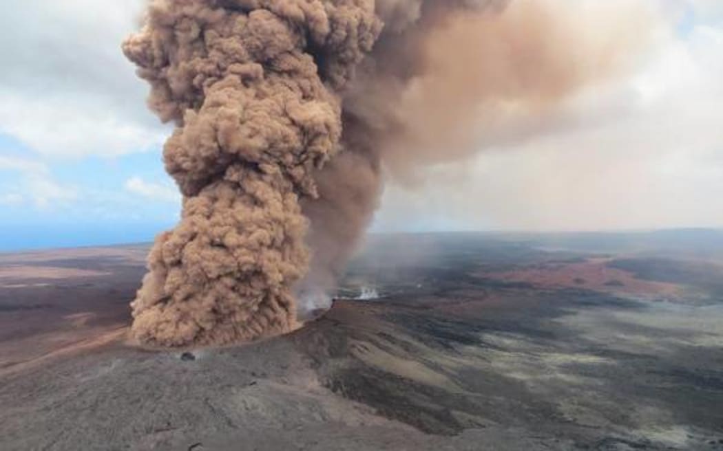 A reddish-brown ash plume after the magnitude 6.9 quake.