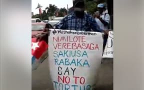 Jope Koroisavu makes a lone anti-torture protest on the pavements of Suva, marking UN Day in Support of Victims of Torture on 26 June 2017