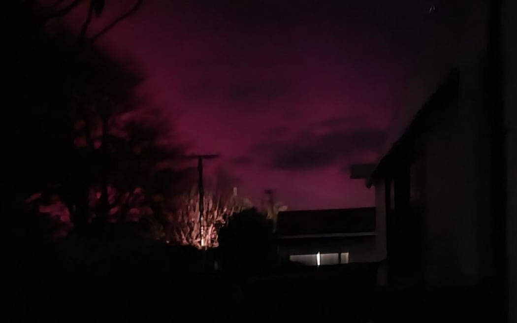 Aurora lights up the sky pink in New Plymouth on 11 May, 2024.