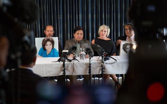 Blessie Gotingco's husband Antonio and family spokesperson Ruth Money talk to the media.