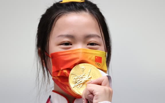 Yang Qian of China celebrates after winning Shooting 10m Air Rifle Women's Final at Asaka Shooting in Saitama Prefecture on July 24, 2021.